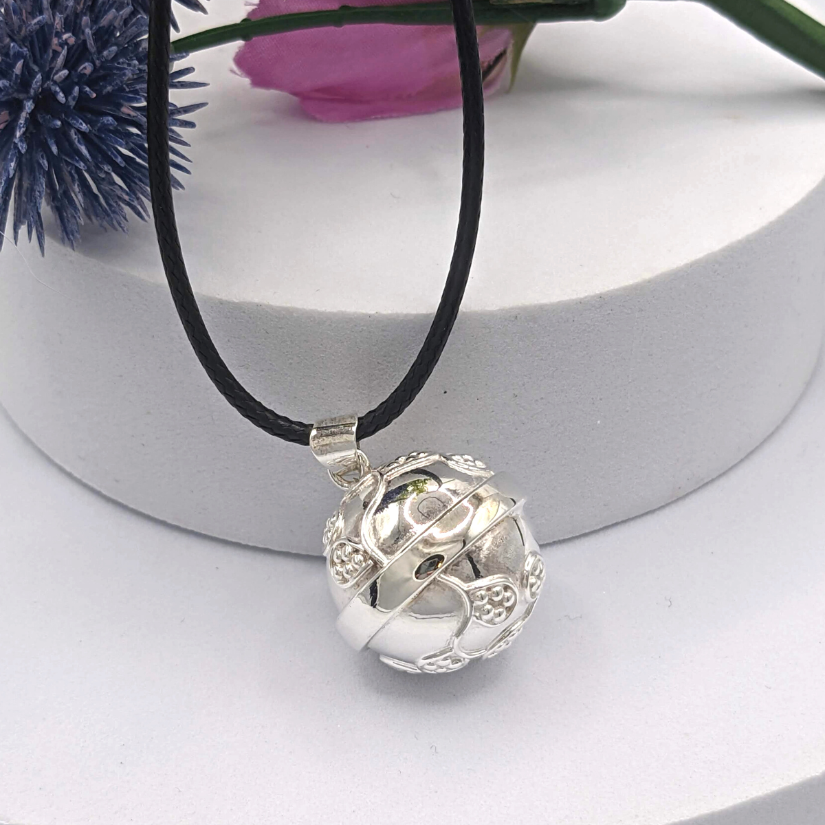 Scrolling Vine Design on Silver Orb with a chime inside. Choose your favorite chain or cord. Nature Reflections Scrolling Vines Angel Caller Necklace